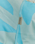 Fiori Turkish towel in Sky Blue – Close-up draped towel showing detail and texture