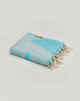 Fiori Turkish towel in Sky Blue – Neatly folded towel, compact and ready for use