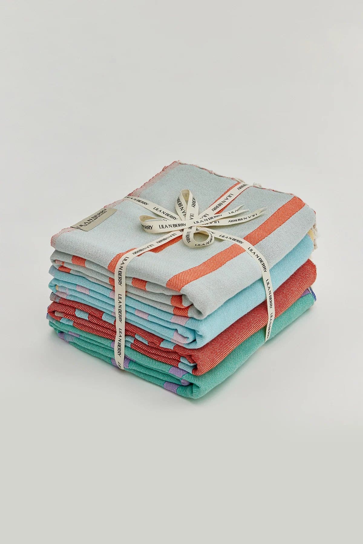 Lane Bundle – Folded bundle with multiple towels, tied with LILA N BERRY ribbon