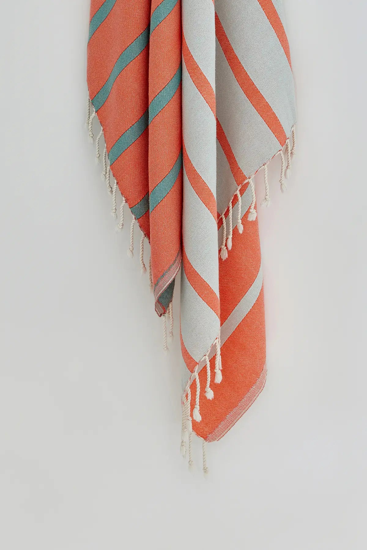 Lane Turkish towel in Peach Cream – Close-up hanging towel highlighting weave and softness