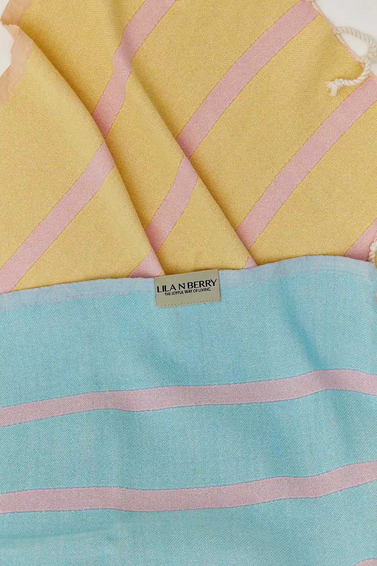 Lane Turkish towel in Pink Blue – Close-up draped towel showing detail and texture