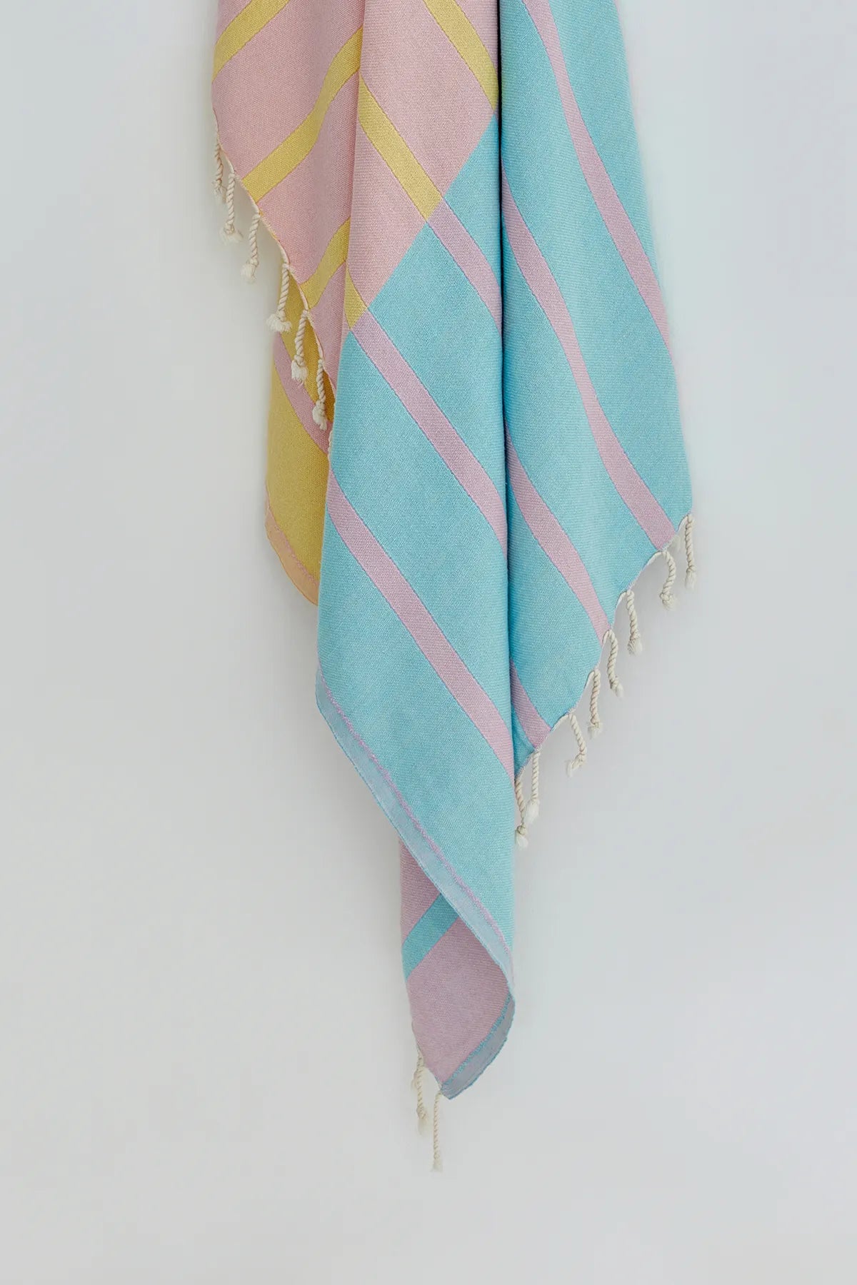 Lane Turkish towel in Pink Blue – Close-up hanging towel highlighting weave and softness