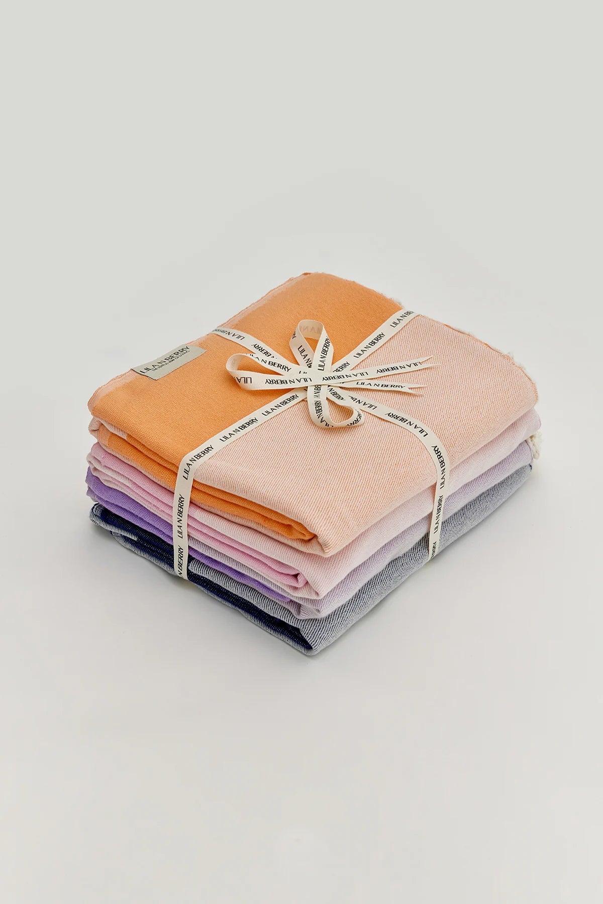 La Luna Bundle – Folded bundle with multiple towels, tied with LILA N BERRY ribbon
