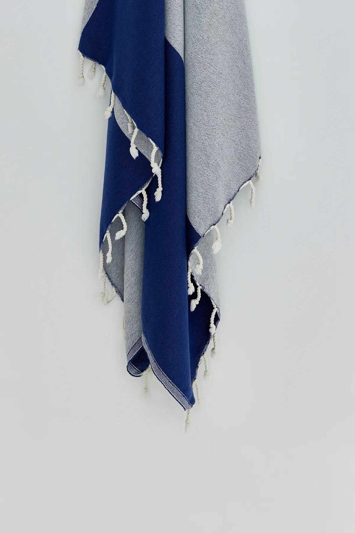 La Luna Turkish towel in Indigo – Close-up hanging towel highlighting weave and softness