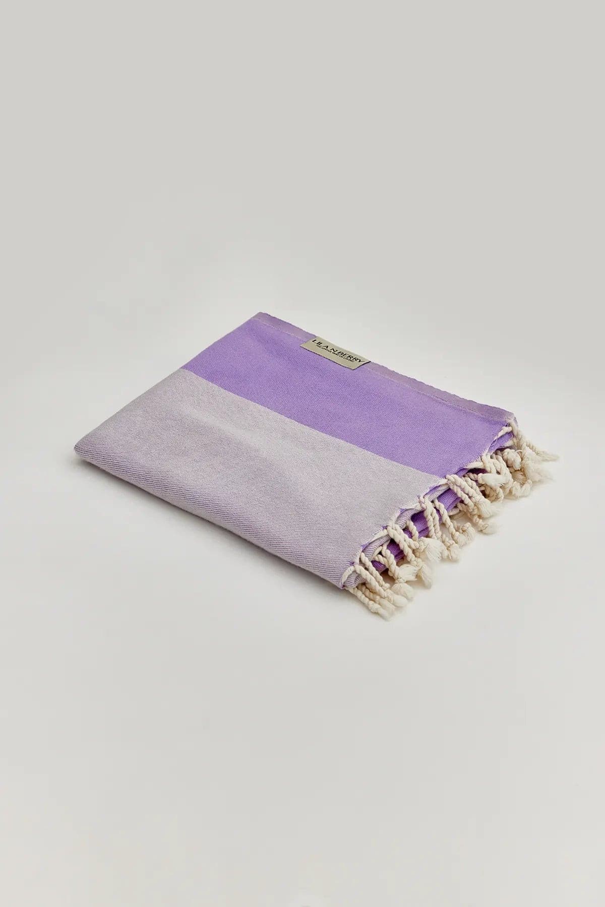 La Luna Turkish towel in Lilac – Neatly folded towel, compact and ready for use