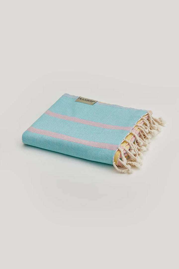 Lane Turkish towel in Pink Blue – Neatly folded towel, compact and ready for use