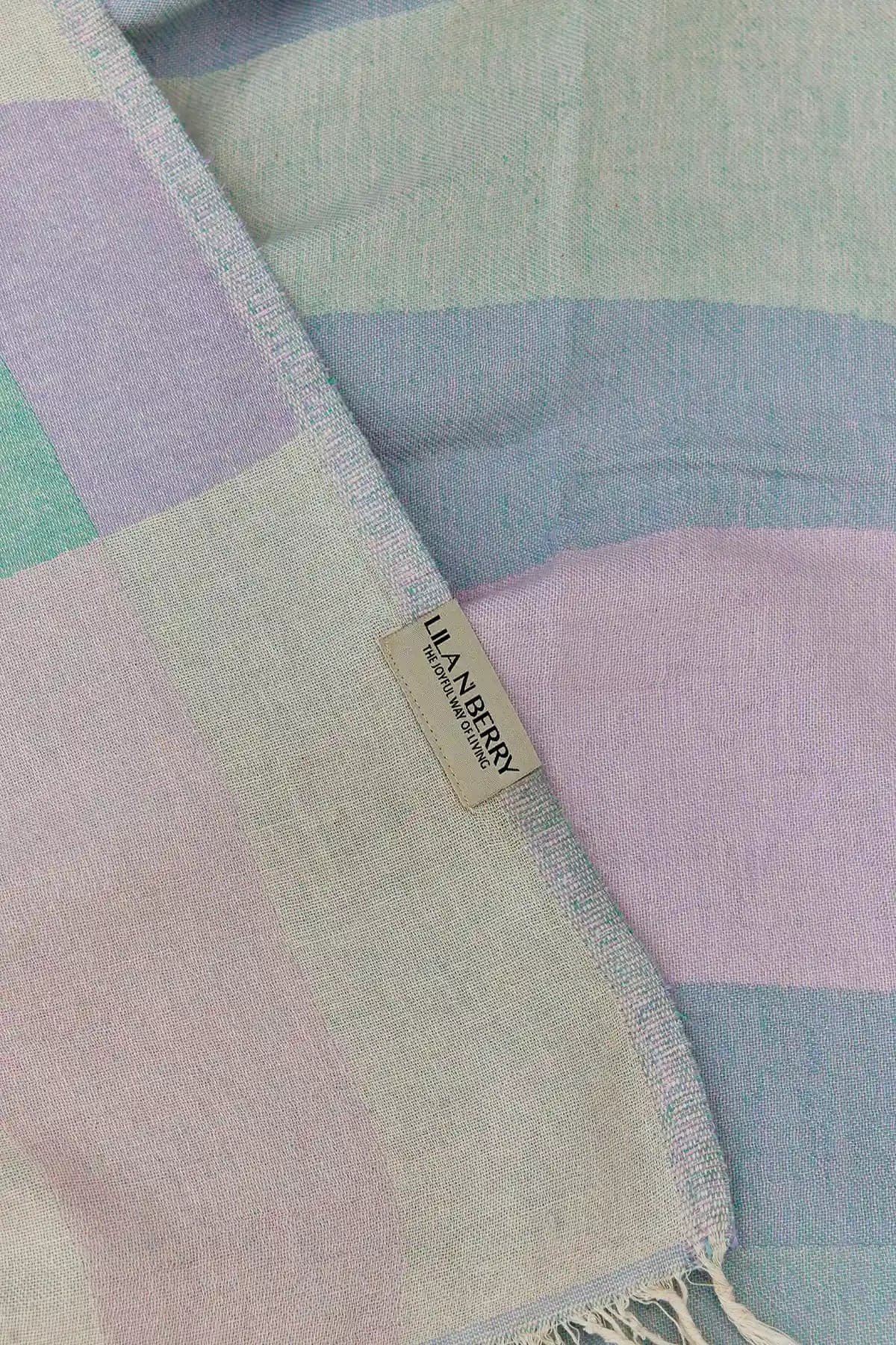 Pale Pluie Turkish towel in Mellow Green – Close-up draped towel showing detail and texture