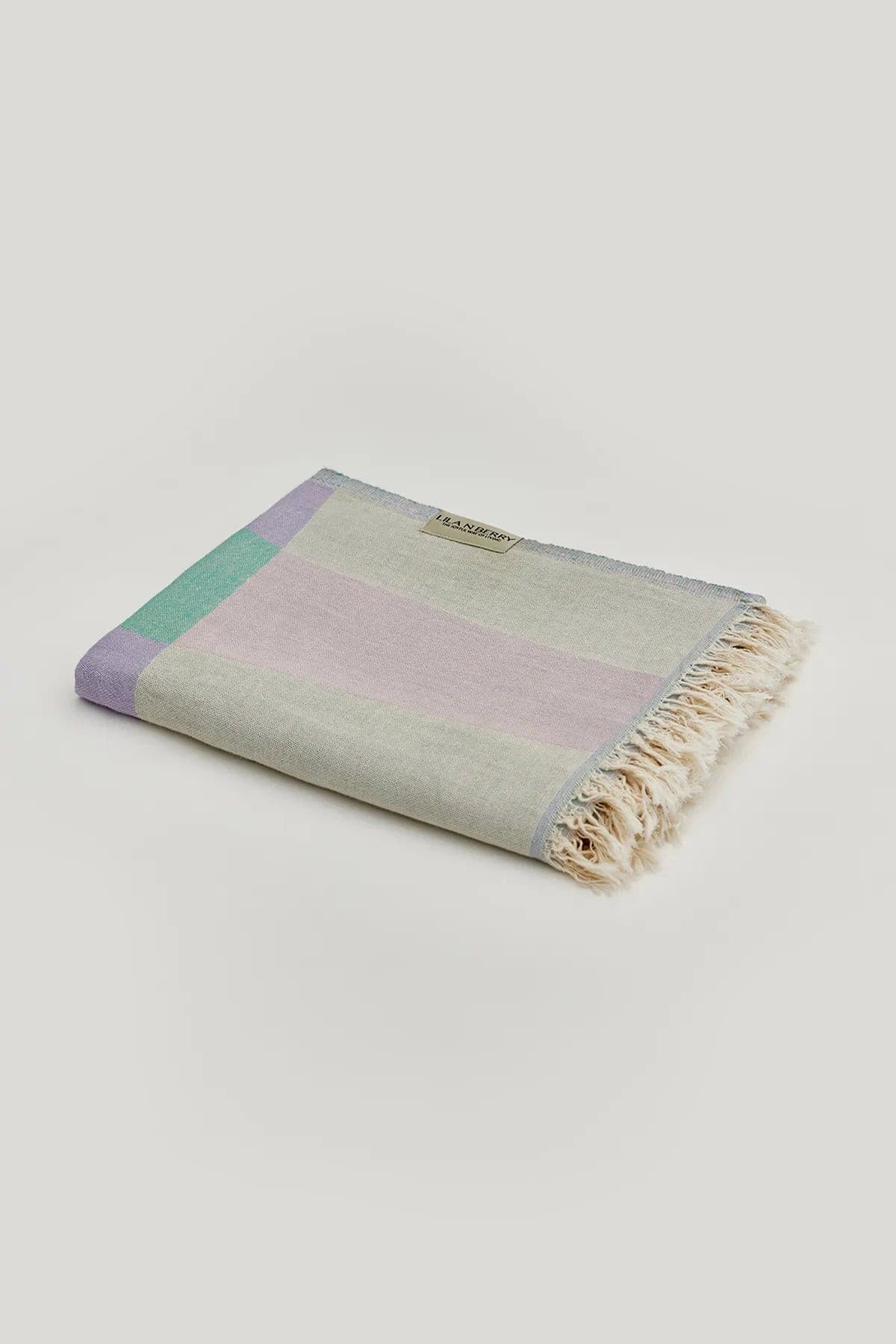 Pale Pluie Turkish towel in Mellow Green – Neatly folded towel, compact and ready for use