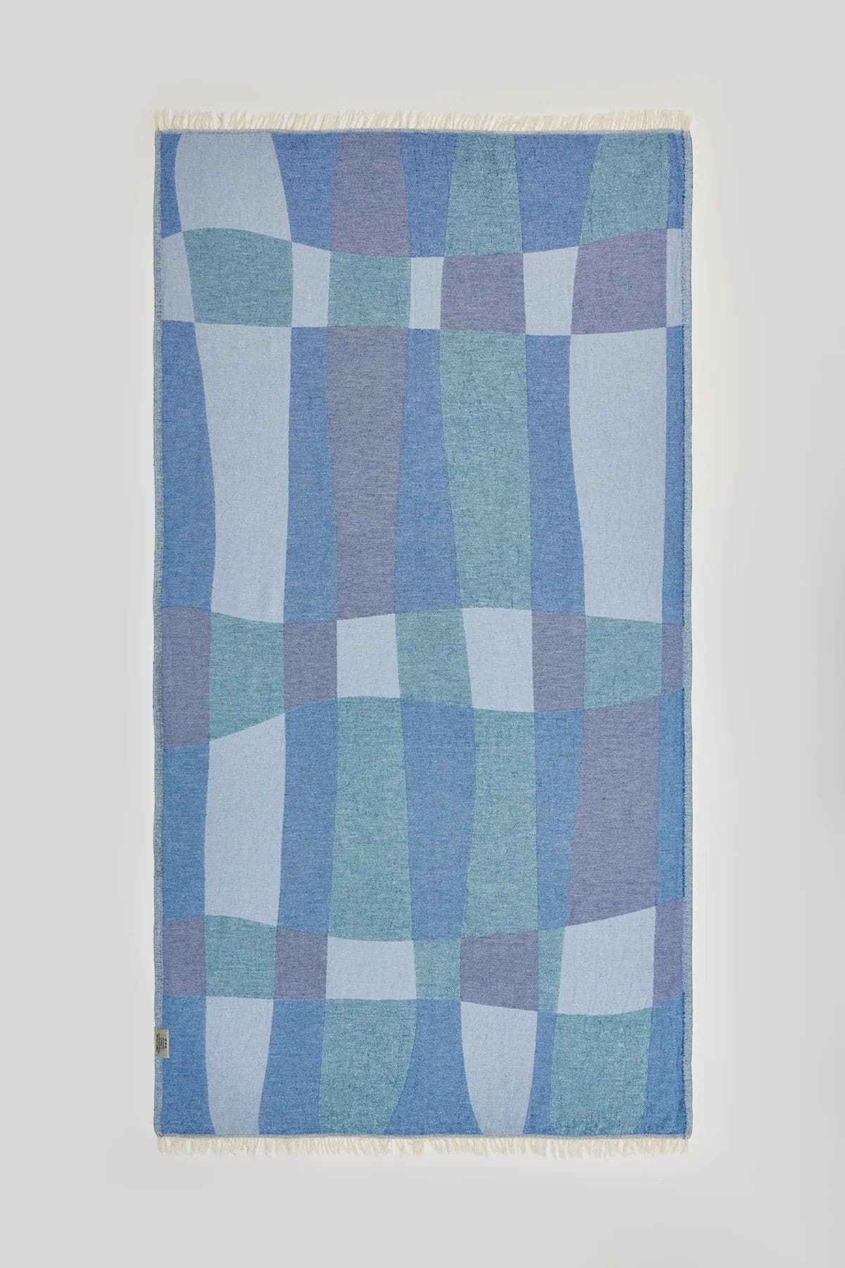 Pale Pluie Turkish towel in Mellow Indigo – Flat lay back side showing reverse weave
