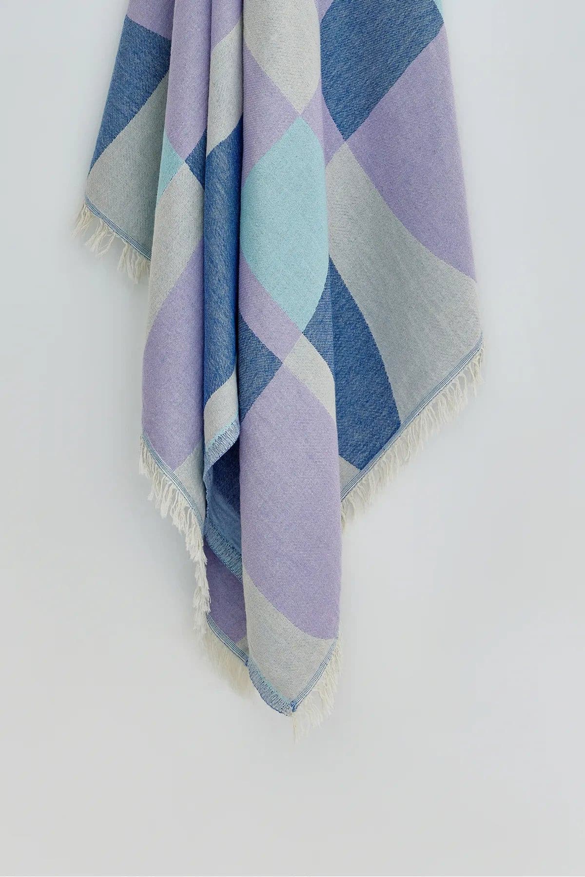 Pale Pluie Turkish towel in Mellow Indigo – Close-up hanging towel highlighting weave and softness